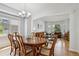 Open dining area next to living room, perfect for entertaining, with ample natural light at 15357 Flowergate Way, Parker, CO 80134
