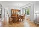 Elegant dining room featuring hardwood floors, a chandelier, and ample natural light at 15357 Flowergate Way, Parker, CO 80134