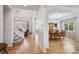 Spacious entryway with hardwood floors that lead to a staircase and dining room at 15357 Flowergate Way, Parker, CO 80134