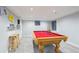 Game room features pool table with red felt and overhead lighting at 15357 Flowergate Way, Parker, CO 80134