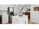 Open kitchen layout flows to living room and stairwell at 15357 Flowergate Way, Parker, CO 80134