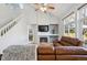 Bright living room with vaulted ceilings and natural light at 15357 Flowergate Way, Parker, CO 80134