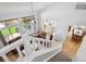 Bright, high ceiling living room featuring a view of the backyard and kitchen at 15357 Flowergate Way, Parker, CO 80134