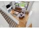 High angle view of living room with hardwood floors, fireplace, and backyard views at 15357 Flowergate Way, Parker, CO 80134
