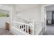 Upstairs hallway featuring a view of the living room and backyard at 15357 Flowergate Way, Parker, CO 80134
