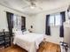 Well-lit bedroom, featuring hardwood floors and a ceiling fan at 9235 Quitman St, Westminster, CO 80031