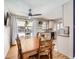 Bright dining room with wooden table and kitchen views at 9235 Quitman St, Westminster, CO 80031