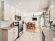 Modern kitchen with white cabinets and stainless steel appliances at 9235 Quitman St, Westminster, CO 80031