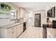 Modern kitchen with stainless steel appliances and plenty of cabinet space at 9235 Quitman St, Westminster, CO 80031