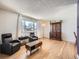 Living room with hardwood floors and large windows at 9235 Quitman St, Westminster, CO 80031