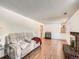 Cozy living room featuring hardwood floors, a fireplace, and comfortable seating at 9235 Quitman St, Westminster, CO 80031