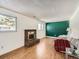 Cozy living room with hardwood floors and a brick fireplace at 9235 Quitman St, Westminster, CO 80031