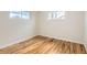 Bright bedroom with hardwood floors and two windows at 2660 Eppinger Blvd, Thornton, CO 80229