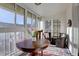 Bright sun room featuring lots of natural light, dark wood table, and comfortable seating at 625 S Clinton St # 6B, Denver, CO 80247