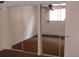 Bedroom boasting mirrored closet doors, neutral walls and carpeting, plus a bright window at 1977 S Josephine St # 101, Denver, CO 80210