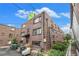 A multi-story brick apartment building showcases a practical and functional design at 1977 S Josephine St # 101, Denver, CO 80210