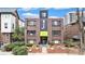 Classic brick apartment building featuring a prominent facade and lush landscaping at 1977 S Josephine St # 101, Denver, CO 80210