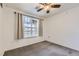 Cozy bedroom with neutral walls, carpeted floors, and a window allowing for ample natural light at 9180 Rolling Way # 303, Parker, CO 80134