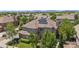 Aerial view of the home with solar panels, mature trees, and fenced yard at 14325 N Santa Fe St, Broomfield, CO 80023