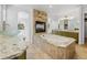 This gorgeous bathroom features a modern standalone tub and beautiful granite countertops at 14325 N Santa Fe St, Broomfield, CO 80023