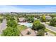 Aerial shot of community pool and play area, surrounded by lush trees and landscaping at 14325 N Santa Fe St, Broomfield, CO 80023