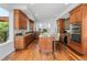 Spacious kitchen features wood cabinets, granite countertops, stainless appliances, and center island at 14325 N Santa Fe St, Broomfield, CO 80023