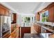 Gourmet kitchen with granite countertops, stainless steel appliances, and hardwood floors at 14325 N Santa Fe St, Broomfield, CO 80023