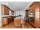 Spacious kitchen features wood cabinets, granite countertops, stainless appliances, and center island at 14325 N Santa Fe St, Broomfield, CO 80023