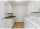 Convenient laundry room with granite countertop, sink, and washer/dryer at 14325 N Santa Fe St, Broomfield, CO 80023