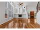 Spacious living room with hardwood floors, fireplace, and a large window at 14325 N Santa Fe St, Broomfield, CO 80023