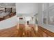 Spacious living room with hardwood floors and fireplace open to kitchen at 14325 N Santa Fe St, Broomfield, CO 80023