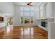 Bright living room boasts hardwood floors, a fireplace, and a wall of windows at 14325 N Santa Fe St, Broomfield, CO 80023