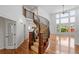 Beautiful staircase featuring wood with iron spindles and wood floors at 14325 N Santa Fe St, Broomfield, CO 80023