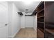 Walk-in closet with custom shelving and plenty of room for storage at 14325 N Santa Fe St, Broomfield, CO 80023