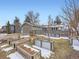 A backyard has a garden in the winter with snow at 7082 W 68Th Pl, Arvada, CO 80003