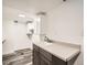 This functional laundry room is equipped with storage cabinets, a sink, and modern finishes at 7082 W 68Th Pl, Arvada, CO 80003