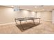Finished basement featuring neutral walls and carpet flooring, plus a table tennis setup at 7573 S Saulsbury Ct, Littleton, CO 80128