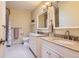 Bright bathroom boasts double sinks, granite countertops, and modern fixtures at 7573 S Saulsbury Ct, Littleton, CO 80128