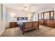Light-filled bedroom featuring carpet, modern furnishings, and decor at 7573 S Saulsbury Ct, Littleton, CO 80128