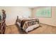 Bedroom with carpet, wood furnishings, and shuttered window at 7573 S Saulsbury Ct, Littleton, CO 80128