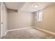 Neutral bedroom featuring neutral walls, carpet flooring, and a window with natural light at 7573 S Saulsbury Ct, Littleton, CO 80128