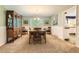 Traditional dining room with wood furniture and a large window at 7573 S Saulsbury Ct, Littleton, CO 80128