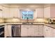 Bright kitchen featuring stainless steel appliances and granite countertops at 7573 S Saulsbury Ct, Littleton, CO 80128