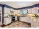 Updated kitchen featuring granite countertops, stainless steel appliances, and ample cabinet space at 7573 S Saulsbury Ct, Littleton, CO 80128