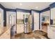 Stylish kitchen featuring stainless steel appliances and slate tile floors at 7573 S Saulsbury Ct, Littleton, CO 80128