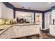 Kitchen and eat-in area featuring granite countertops and an eat-in area at 7573 S Saulsbury Ct, Littleton, CO 80128
