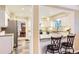Bright kitchen with granite countertops, stainless steel appliances, and slate tile flooring at 7573 S Saulsbury Ct, Littleton, CO 80128