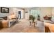 Cozy living room featuring plush carpeting, comfortable seating, and bright natural light at 7573 S Saulsbury Ct, Littleton, CO 80128