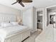 Bedroom featuring whitewashed furniture, a ceiling fan and closet, adjacent to the bathroom at 2578 Palau Way, Castle Rock, CO 80109