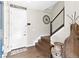 Welcoming foyer features a staircase, coat rack, and stylish decor, creating a warm entry at 2578 Palau Way, Castle Rock, CO 80109